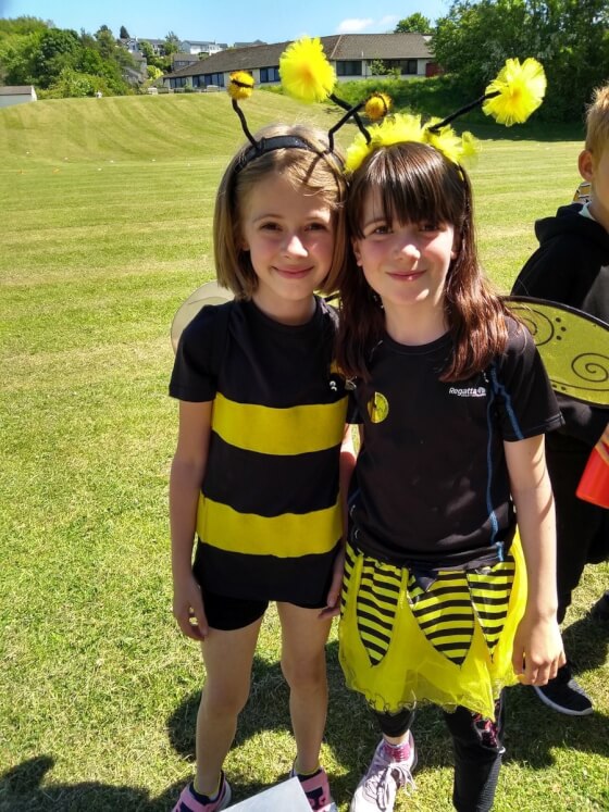 Two young pupils dressed as bees